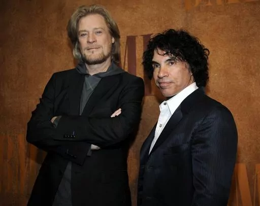 Daryl Hall, left, and John Oates, recipients of BMI Icons awards, pose together before the 56th annual BMI Pop Awards in Beverly Hills, Calif., on May 20, 2008. Hall has sued his longtime music partner John Oates, arguing that his plan to sell off his share of a joint venture would violate a business agreement the duo had.(AP Photo/Chris Pizzello, File)