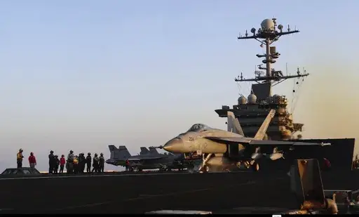 This image taken from video provided by the U.S. Navy shows an aircraft launching from the USS Harry S. Truman in the Red Sea before airstrikes in Sanaa, Yemen, Saturday, March 15, 2025. (U.S. Navy via AP)