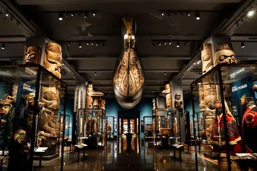 Artifacts, dioramas, and representations of Native American culture from the northwest coast of North America are displayed, Tuesday, May 10, 2022, at the American Museum of Natural History in New York. The oldest gallery at the American Museum of Natural History, the Northwest Coast Hall, is reopening to the public Friday after an extensive 5-year, $19 million renovation based on input from representatives of all the Indigenous tribes whose cultures are on display. (AP Photo/John Minchillo)