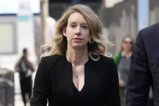 Former Theranos CEO Elizabeth Holmes leaves federal court in San Jose, Calif., March 17, 2023. On Monday, April 10, Holmes was rebuffed in her attempt to stay out of federal prison while she appeals her conviction for the fraud she committed while overseeing a blood-testing scam that exposed Silicon Valley’s dark side. (AP Photo/Jeff Chiu, File)