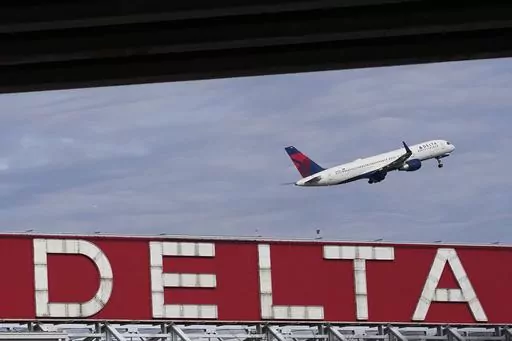 A Delta Air Lines plane takes off from Hartsfield-Jackson Atlanta International Airport in Atlanta, Nov. 22, 2022. A consumer class action lawsuit filed Tuesday, May 30, 2023, claims Delta Air Lines inaccurately billed itself as the world's “first carbon-neutral airline” and should pay damages. The complaint in California federal court alleges the airline relied on carbon offsets that were largely bogus. (AP Photo/Brynn Anderson, File)