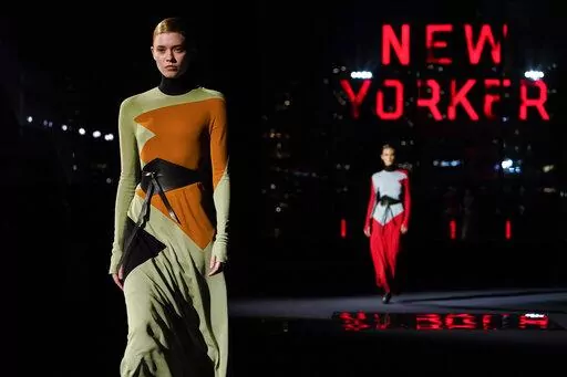 Fashion from the Tory Burch fall/winter 2022 collection is modeled during Fashion Week, Monday, Feb. 14, 2022, in New York. (AP Photo/John Minchillo)