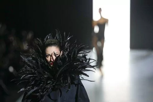 A model wears a creation as part of the Dolce & Gabbana women's Fall-Winter 2023-24 collection presented in Milan, Italy, Saturday, Feb. 25, 2023. (AP Photo/Antonio Calanni)