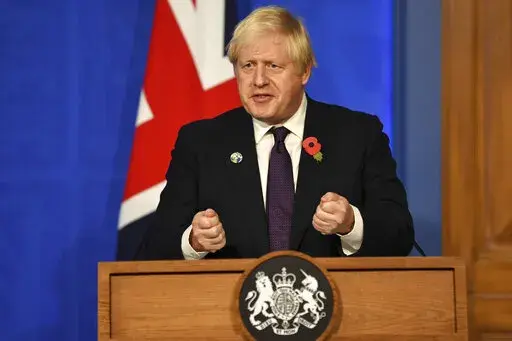 Britain's Prime Minister Boris Johnson during a press conference in Downing Street, London, Sunday, Nov. 14, 2021 about the Cop26 climate summit. (Daniel Leal/Pool photo via AP)