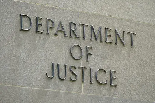 An exterior sign is photographed outside the Robert F. Kennedy Department of Justice building in Washington on May 4, 2021. President Joe Biden is nominating six lawyers to run U.S. attorney’s offices across the country, a diverse group of candidates in the latest picks for the top law enforcement positions. The nominees, being announced by the White House on Wednesday, Jan. 26, 2022, would run the federal prosecutors’ offices in Connecticut, Utah, Montana, Alaska, New Mexico and New Hampshi