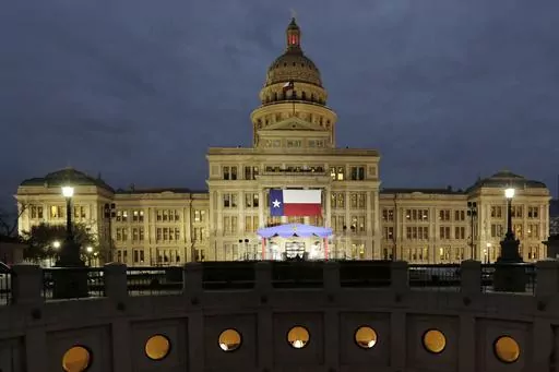 In this Jan. 14, 2019 file photo, a large Texas flag hangs from the Texas State Capitol in Austin, Texas. A federal judge has struck down a Texas law requiring age verification and health warnings to view pornographic websites and blocked the state attorney general's office from enforcing it. U.S. District Judge David Ezra on Thursday, Aug. 31, 2023 agreed with claims that the bill signed into law by Gov. Greg Abbott in June violates free speech rights, is overbroad and vague.(AP Photo/Eric Gay,