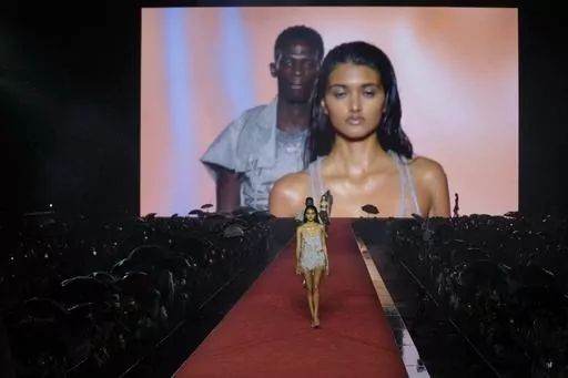 A model wears a creation as part of the Diesel women's Spring Summer 2024 collection presented in Milan, Italy, Wednesday, Sept. 20, 2023. (AP Photo/Luca Bruno)