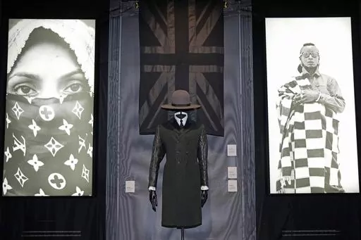 A black union jack shawl, Madhatter crown hat and Rudie coat designed by London-based art collective Art Comes First, are displayed during a preview of the exhibition titled "The Missing Thread: Untold Stories of Black British Fashion", at Somerset House, in London, Tuesday, Sept. 19, 2023. A new exhibition is opening in London to chart for the first time the contributions Black British culture made to U.K. fashion and design history and to celebrate Black designers who have not received public 