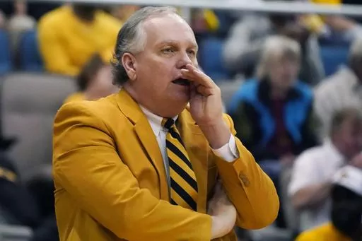 Southern Mississippi head coach Jay Ladner calls out to his team during the first half of an NCAA college basketball game against Mississippi, Saturday, Dec. 23, 2023, in Biloxi, Miss. Southern Mississippi coach Jay Ladner was hospitalized Tuesday morning, Feb. 6, 2024 after suffering what the school described as a “heart-related medical emergency.” (AP Photo/Rogelio V. Solis, File)