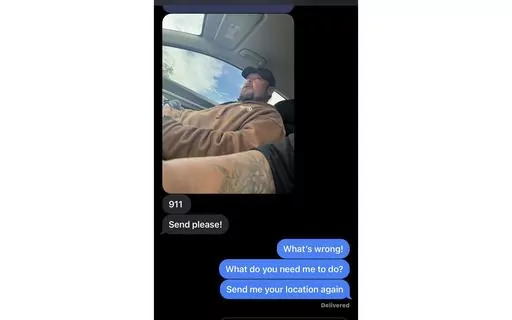 This photo provided by Talija Campbell shows a desperate text message exchange between Campbell and her husband, Qualin Campbell, who indicated that he had been taken hostage, in Colorado Springs, Colo., Friday, June 2, 2023. Qualin Campbell, whose tattooed arm is seen in the foreground, and the other man shown, who is unknown, were later found dead in Campbell's car. (Talija Campbell via AP)