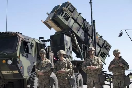 Members of US 10th Army Air and Missile Defense Command stands next to a Patriot surface-to-air missile battery during the NATO multinational ground based air defence units exercise "Tobruq Legacy 2017" at the Siauliai airbase some 230 km. (144 miles) east of the capital Vilnius, Lithuania, on July 20, 2017. Ukraine’s defense minister said Wednesday April 19, 2023 his country has received U.S-made Patriot surface-to-air guided missile systems it has long craved and which Kyiv hopes will help s