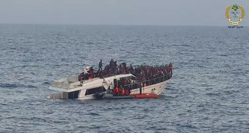 File In this photo released by the Lebanese Army, shows Lebanese army on their dinghy, rescuing migrants from a boat sinking in the Mediterranean Sea, near the shores of Tripoli, north Lebanon, Saturday, Dec. 31, 2022. A short Lebanese army statement said the vessel was carrying people "who were trying to illegally leave Lebanon's territorial waters." It said three Lebanese navy boats and one from the U.N. peacekeeping force in Lebanon, known as UNIFIL, were rescuing the approximately 200 migran