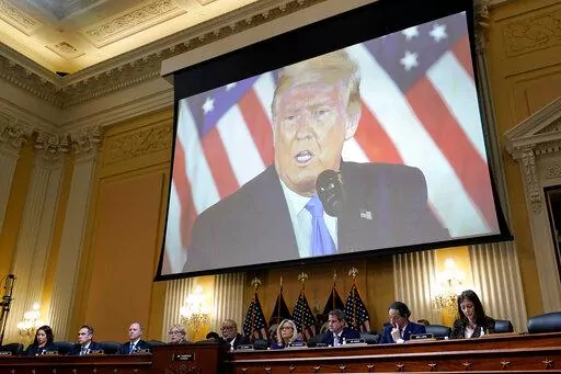 A video of former President Donald Trump is shown on a screen, as the House select committee investigating the Jan. 6 attack on the U.S. Capitol holds its final meeting on Capitol Hill in Washington, Dec. 19, 2022. From left to right, Rep. Stephanie Murphy, D-Fla., Rep. Pete Aguilar, D-Calif., Rep. Adam Schiff, D-Calif., Rep. Zoe Lofgren, D-Calif., Chairman Bennie Thompson, D-Miss., Vice Chair Liz Cheney, R-Wyo., Rep. Adam Kinzinger, R-Ill., Rep. Jamie Raskin, D-Md., and Rep. Elaine Luria, D-Va.