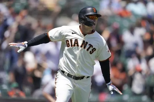 San Francisco Giants' Joc Pederson watches his two-run home run during the first inning of a baseball game against the New York Mets in San Francisco, Wednesday, May 25, 2022. Pederson is scared to fly and shortly after arriving in San Francisco he began working with the club's director of mental health and wellness Shana Alexander and human performance specialist Harvey Martin to cope with his flight anxiety. (AP Photo/Jeff Chiu, File)