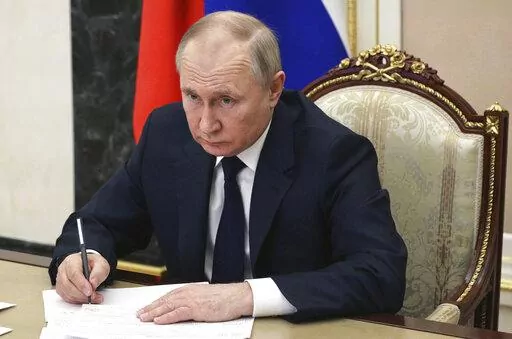 Russian President Vladimir Putin chairs a meeting with members of the government via teleconference in Moscow, Thursday, March 10, 2022. (Mikhail Klimentyev, Sputnik, Kremlin Pool Photo via AP, File)