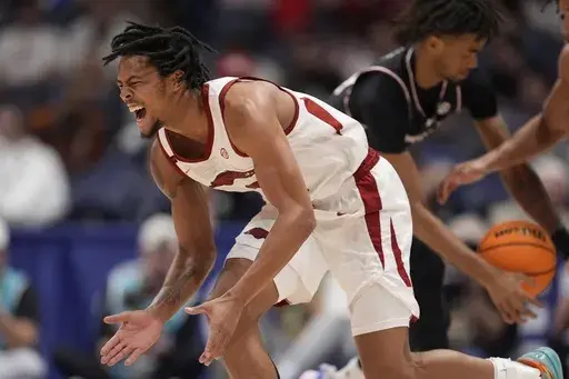 Arkansas guard D.J. Wagner (21) reacts to play against South Carolina during the second half of an NCAA college basketball game at the Southeastern Conference tournament, Wednesday, March 12, 2025, in Nashville, Tenn. (AP Photo/George Walker IV)