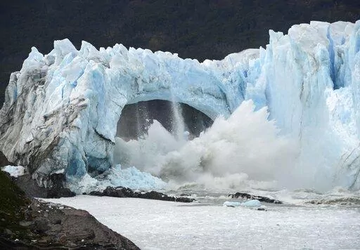 Chunks of ice break off the Perito Moreno Glacier, in Lake Argentina, at Los Glaciares National Park, near El Calafate, in Argentina's Patagonia region, March 10, 2016. As glaciers melt and pour massive amounts of water into nearby lakes, 15 million people across the globe live under the threat of a sudden and deadly outburst flood, a new study finds. (AP Photo/Francisco Munoz, File)