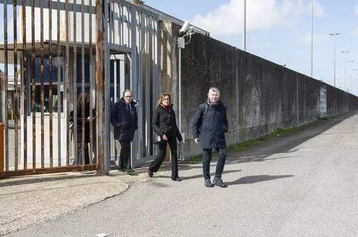 From left, Italian Senators Walter Verini, Ilaria Cucchi, and Ivan Scalfarotto exit a migrants repatriation center in Ponte Galeria, in the outskirts of Rome after a surprise visit, Wednesday, March 6, 2024. Pressure is building on Italy authorities to close the notorious migrant detention center of Ponte Galeria where Ousmane Sylla, a Guinean migrant, hung himself last month and visiting opposition senators described inhuman conditions for people ordered to leave Italy but still awaiting repatr