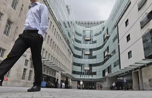 A view of the main entrance to the headquarters of the publicly funded BBC in London, Wednesday, July 19, 2017. Senior British politicians on Sunday, July 9, 2023 called on the BBC to rapidly investigate a complaint that a leading presenter paid a teenager for explicit photos. The publicly funded national broadcaster is under pressure after The Sun newspaper reported allegations that the male presenter gave a youth 35,000 pounds ($45,000) starting in 2020 when the young person was 17. (AP Photo/