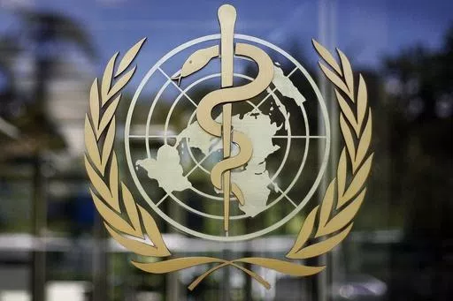 The logo of the World Health Organization is seen at the WHO headquarters in Geneva, Switzerland, June 11, 2019. A death in Mexico was caused by a strain of bird flu that has never before been found in a human, the World Health Organization said Wednesday. (AP Photo/Anja Niedringhaus, File)
