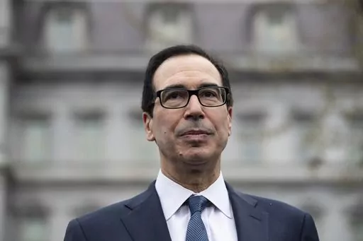 Former Treasury Secretary Steve Mnuchin speaks with reporters at the White House, March 13, 2020, in Washington. Mnuchin is interested in buying TikTok, just days after his investment firm led a $1 billion deal to inject life into a beaten-down bank.(AP Photo/Alex Brandon, File)