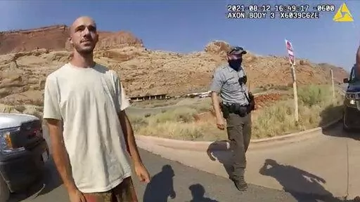 This Aug. 12, 2021, file photo from video provided by the Moab, Utah, Police Department shows Brian Laundrie talking to a police officer after police pulled over the van he was traveling in with his girlfriend, Gabrielle "Gabby" Petito, near the entrance to Arches National Park in Utah. Laundrie, the boyfriend of slain cross-country traveler Gabby Petito, took responsibility for killing her in a notebook discovered near his body in a Florida swamp, the FBI announced Friday, Jan. 21, 2022. (The M