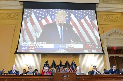 A video exhibit plays as the House select committee investigating the Jan. 6 attack on the U.S. Capitol continues to reveal its findings of a year-long investigation, at the Capitol in Washington, Monday, June 13, 2022. (AP Photo/Susan Walsh)