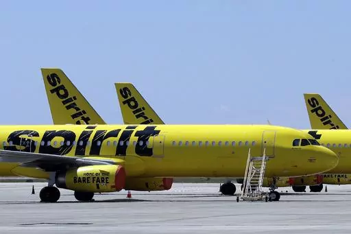 A line of Spirit Airlines jets sit on the tarmac at Orlando International Airport on May 20, 2020, in Orlando, Fla. A 6-year-old boy who left on a flight for the Christmas holiday to visit his grandmother was put on the wrong plane. When the grandmother, up on Thursday, Dec. 21, 2023 at the airport in Fort Myers to greet her grandson who was flying for the first time from Philadelphia, she was told he wasn’t on the Spirit Airlines flight. (AP Photo/Chris O'Meara, File)