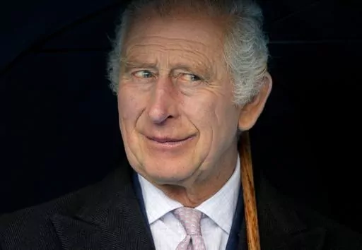 Britain's King Charles III smiles during a boat trip, in Hamburg, Germany, Friday, March 31, 2023. King Charles III arrived Wednesday for a three-day official visit to Germany. Britain’s royal family turns the page on a new chapter with the coronation of King Charles III. Charles ascended the throne when his mother, Queen Elizabeth II, died last year. But the coronation Saturday is a religious ceremony that provides a more formal confirmation of his role as head of state and titular head of th