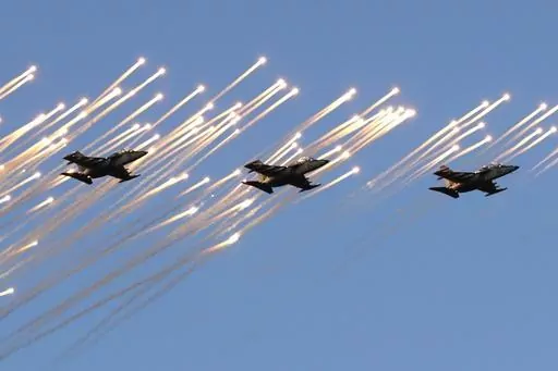 Belarusian army Su-25 jet fighters fly during a parade marking Independence Day in Minsk, Belarus, Wednesday, July 3, 2019. Russian President Vladimir Putin has announced that he intends to deploy tactical nuclear weapons on the territory of Belarus. The move appears to be another attempt by Putin to raise the stakes in the conflict in Ukraine. (AP Photo/Sergei Grits, File)