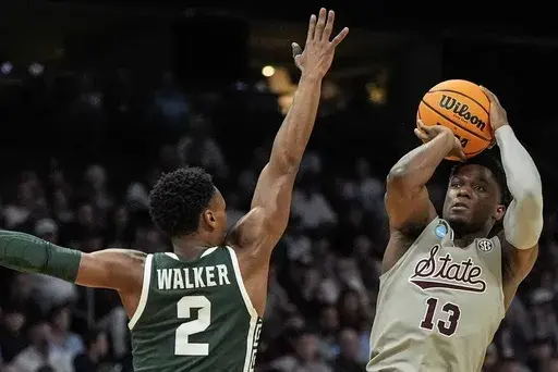 Mississippi State guard Josh Hubbard (13) shoots against Michigan State guard Tyson Walker (2) during the first half of a first-round college basketball game in that NCAA Tournament, March 21, 2024, in Charlotte, N.C. (AP Photo/Mike Stewart, File)
