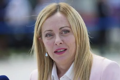 Giorgia Meloni, Prime Minister of Italy, speaks to media as she arrives for the European Political Community Summit at the Mimi Castle in Bulboaca, Moldova, Thursday, June 1, 2023. On Friday, June 9, The Associated Press reported on stories circulating online incorrectly claiming Meloni launched “Family Pride Month” to promote “traditional families” as a counterpoint to events celebrating the LGBTQ+ community. (Carl Court/Pool Photo via AP, File)