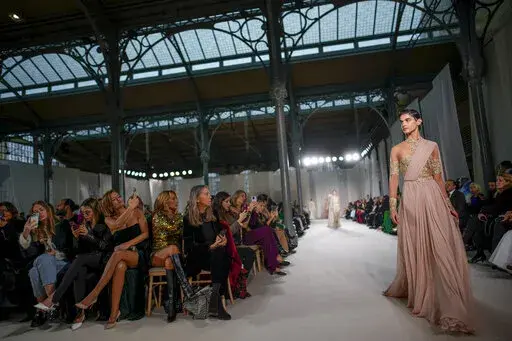 A model wears a creation as part of the Elie Saab Haute Couture Spring-Summer 2023 collection presented in Paris, Wednesday, Jan. 25, 2023. (AP Photo/Christophe Ena)