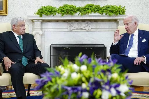 President Joe Biden speaks as he meets with Mexican President Andrés Manuel López Obrador in the Oval Office of the White House in Washington, July 12, 2022. Biden will become the first U.S. leader to visit Mexico in nearly a decade. In the leadup to his visit, Biden announced a major border policy shift with Mexico's blessing that will result in the U.S. returning 30,000 migrants from other countries per month over the border. (AP Photo/Susan Walsh, File)