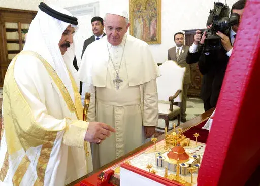 Pope Francis, right, is presented with a scale model of the building project of the biggest Catholic church in the Gulf region, by Bahrain's King Hamad bin Isa Al Khalifa during a private audience at the Vatican, Monday, May 19, 2014. Pope Francis is making the first-ever papal trip to Bahrain between Nov. 3-6, 2022, sparking calls from the country’s majority Shiite opposition and human rights activists for the pontiff to raise human rights concerns in the small island nation. (AP Photo/Claudi