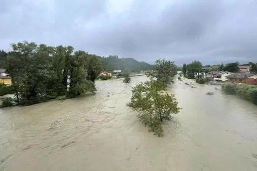 A view of an overflowing Savio river in Cesena, central Italy, Wednesday, May 17, 2023. The mayor of the city of Cesena, Enzo Lattuca, posted a video early Wednesday on Facebook to warn that continued heavy rains in the Emilia-Romagna region could again flood the Savio river and smaller tributaries. He urged residents to move to upper floors of their homes and avoid riverbanks, and announced the closure to traffic of some bridges and streets after heavy flooding sent rivers of mud sloshing throu