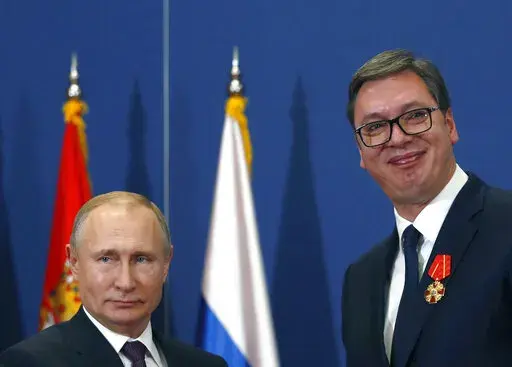 FILE- Russian President Vladimir Putin, left, poses with Serbian President Aleksandar Vucic after being awarded the Order of Alexander Nevsky in Belgrade, Serbia, Thursday, Jan. 17, 2019. Vucic said he has secured an "extremely favorable" gas deal with Russia during his telephone conversation with Vladimir Putin on Sunday, May 29, 2022. The Serbian populist president has announced that he has secured an “extremely favorable” gas deal with Russia. Serbian President Aleksandar Vucic, a former 