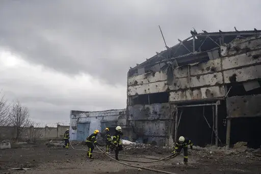 Firefighters try to extinguish the fire at a damaged factory following a Russian bombing in Kramatorsk, Ukraine, Thursday, April 14, 2022. (AP Photo/Petros Giannakouris)