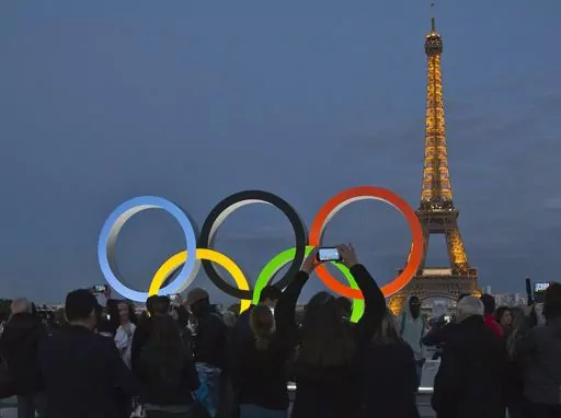 The Olympic rings are set up on Trocadero plaza that overlooks the Eiffel Tower, a day after the official announcement that the 2024 Summer Olympic Games will be in the French capital, in Paris, Thursday, Sept. 14, 2017. The organizers of the Paris Games say the Olympic rings will be displayed on the Eiffel Tower. The five-ring creation is 29-meters long and 15-meter high, made entirely of recycled steel, the Games organizers said in a statement Monday April, 8, 2024. (AP Photo//Michel Euler, Fi