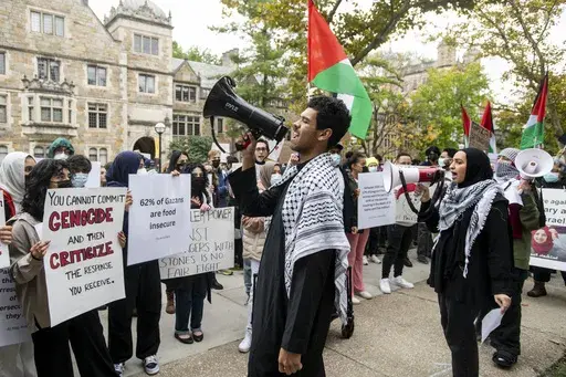 Pro-Palestinian demonstrators gather to protest University of Michigan President Santa Ono's "Statement regarding Mideast violence" outside the University of Michigan President's House, Oct. 13, 2023, in Ann Arbor, Mich. The University of Michigan failed to assess whether protests and other incidents on campus in response to the Israel-Hamas war created a hostile environment for students, staff and faculty. That's according to the results of an U.S. Education Department investigation announced M