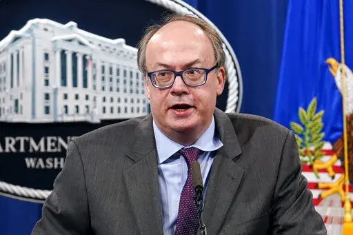 Jeffrey Clark, then-Assistant Attorney General for the Environment and Natural Resources Division, speaks during a news conference at the Justice Department in Washington, on Sept. 14, 2020. Federal agents have searched the Virginia home of the Trump-era Justice Department official who championed efforts by President Donald Trump to overturn the results of the 2020 election.  (AP Photo/Susan Walsh, Pool, File)