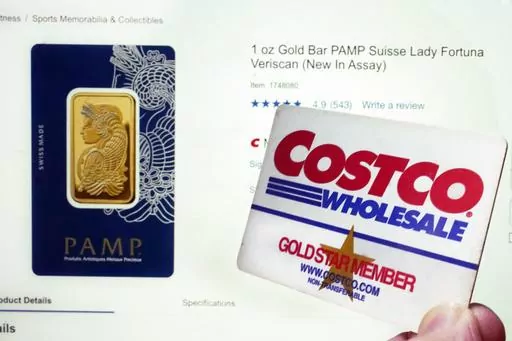 A Costco webpage featuring a one-ounce Gold Bar PAMP Suisse Lady Fortuna Veriscan, and a Costco membership card, are shown in this photo, in New York, Wednesday, Oct. 4, 2023. Costco CFO Richard Galanti said the gold bars, which are sold exclusively online, are "typically gone within a few hours" of appearing on the chain's website — adding that there's a two-bar limit per member. (AP Photo/Richard Drew)