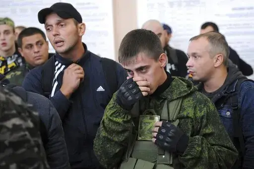 FILE Russian recruits gather inside a military recruitment center of Bataysk, Rostov-on-Don region, south of Russia, Monday, Sept. 26, 2022. Russian President Vladimir Putin last Wednesday ordered a partial mobilisation of reservists to beef up his forces in Ukraine. (AP Photo, File)