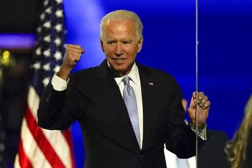 Then-President-elect Joe Biden gestures to supporters Nov. 7, 2020, in Wilmington, Del. Some voters in last year's midterm elections were open to supporting Democrats even if they weren't fond of President Joe Biden. Roughly 1 in 6 voters for Democratic House candidates said they disapproved of Biden's job performance, but most said Biden wasn't a factor in their midterm decision. (AP Photo/Andrew Harnik, File)