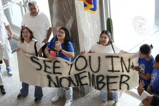 Opponents to an immigration proposal gather inside the Arizona State Capitol, Tuesday, June 4, 2024, in Phoenix. (AP Photo/Matt York, File)