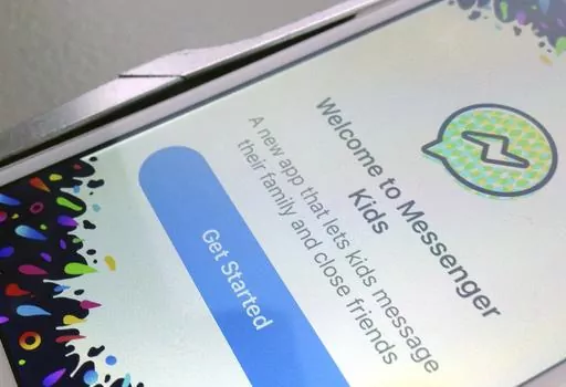 This photo shows the Facebook's Messenger Kids application on an iPhone in New York, Feb. 16, 2018. U.S. regulators say Facebook misled parents and failed to protect the privacy of children using its Messenger Kids app. The Federal Trade Commission says Facebook misrepresented the access it provided to app developers to private user data. As a result, the FTC on Wednesday, May 3, 2023 proposed sweeping changes to a 2020 privacy order with Facebook — now called Meta — that would prohibit it f