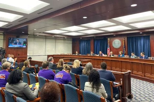 Reproductive Freedom for All leaders and supporters await the Michigan Board of Canvassers vote to send their initiative to the November ballot during a Friday, Sept. 9, 2022, meeting in Lansing, Mich. (Joey Cappelletti/Report for America via AP)