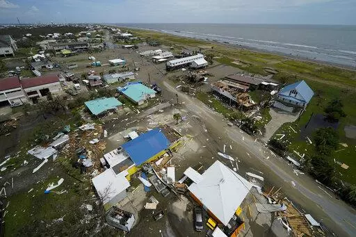 The remains of destroyed homes and businesses are seen in the aftermath of Hurricane Ida in Grand Isle, La., Tuesday, Aug. 31, 2021. (AP Photo/Gerald Herbert)