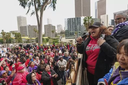 Cecily Myart-Cruz, United Teachers Los Angeles, UTLA President, with Max Arias, executive director of the Service Employees International SEIU Local 99 union, speak to thousands of Los Angeles Unified School District teachers and SEIU members rallying outside the LAUSD headquarters in Los Angeles Tuesday, March 21, 2023. Thousands of service workers backed by teachers began a three-day strike against the Los Angeles Unified School District on Tuesday, shutting down education for a half-million s