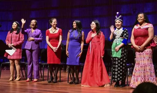 St. Paul City Council members, from left, Mitra Jalali, Anika Bowie, Rebecca Noecker, Saura Jost, HwaJeong Kim, Nelsie Yang and Chenique Johnson are introduced at the start of the inauguration ceremony for St. Paul City Council members in St. Paul, Minn. on Tuesday, Jan. 9, 2024. The youngest and most diverse city council in the history of Minnesota's capital city was sworn into office Tuesday, officially elevating the first all-female St. Paul City Council into public service at City Hall. (Joh